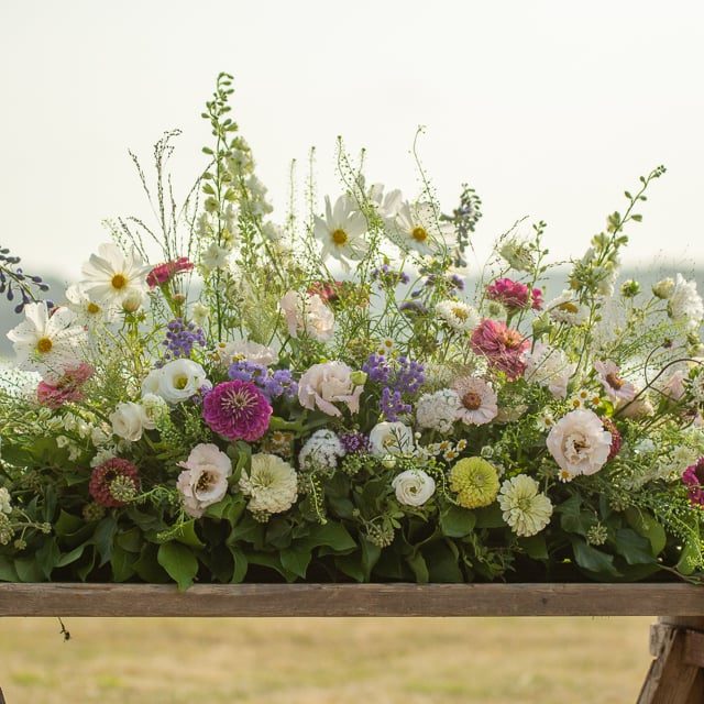 Country garden style funeral spray