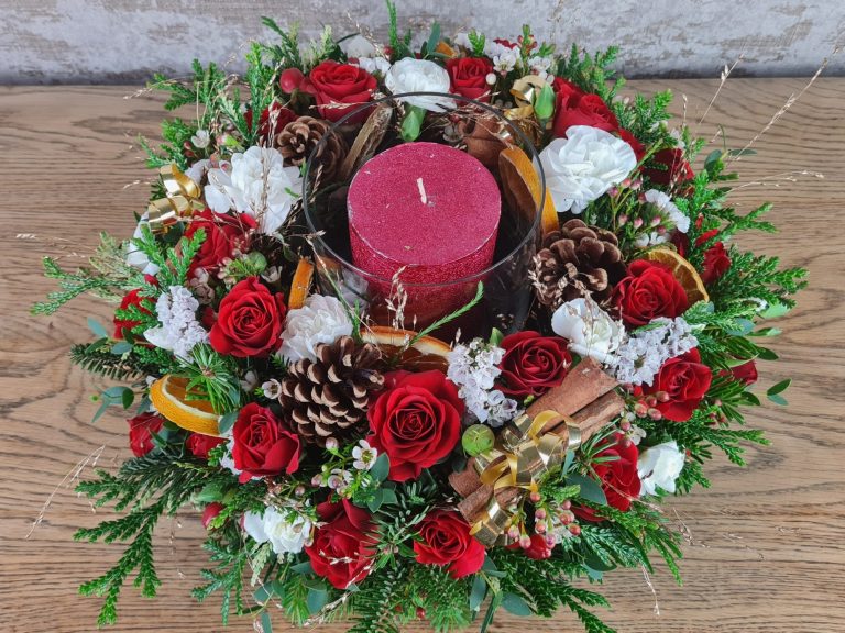 Christmas Table Decoration with fresh flowers and dried fruits